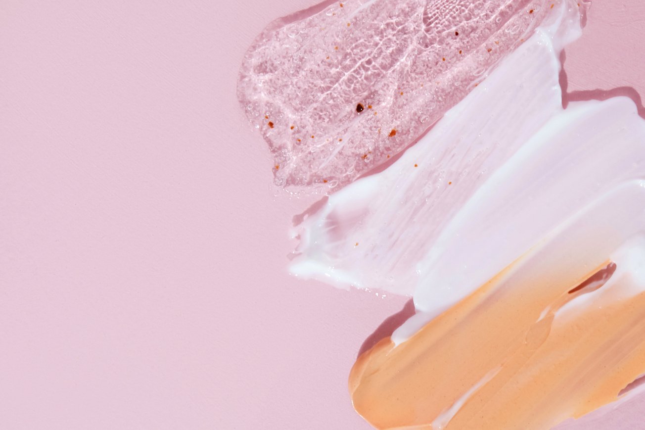 Cosmetic Swatches on Pink Background